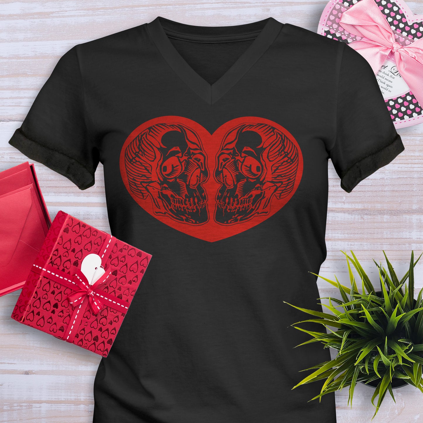 Black Valentines Day V-Neck T-Shirt with a red heart that has 2 skulls inside