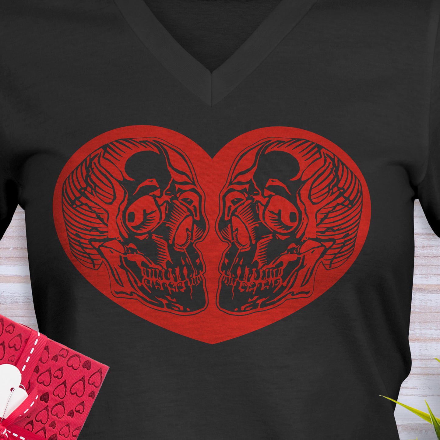 Black Valentines Day V-Neck T-Shirt with a red heart that has 2 skulls inside